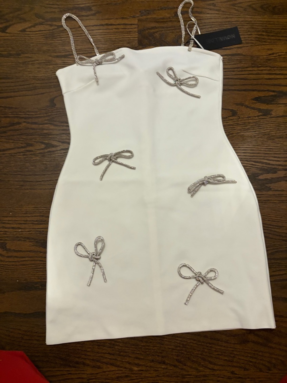NWT Fashion Nova White bandage dress with silver bows and rhinestone straps sz M